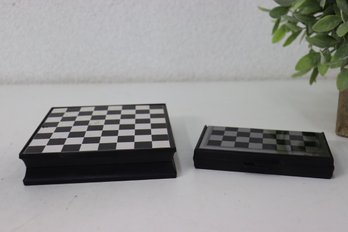Two Black And White Chess Board/Box Sets With Chess Pieces