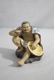 'The Resting Traveler'  Chinese Mud Pottery Figurine
