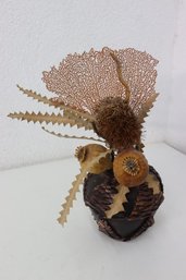 Collection Of Dried Botanicals In Pinecone Motif Vase