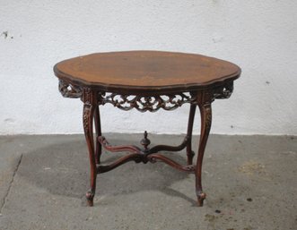Antique Carved Wooden Oval Table With Intricate Inlay And Filigree Detailing