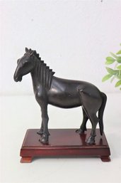 Chinese Patinated Bronze Models Of Horses On Fitted Wood Stand