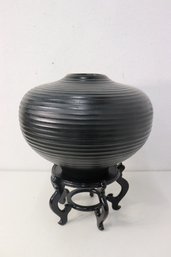 Wheel Thrown Fluted Black Turnip Form Pottery Vase On Carved Asian Wooden Stand