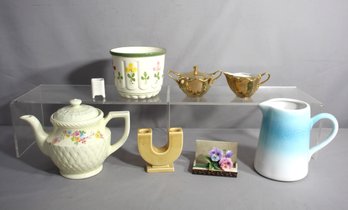 Eclectic Mix Of Ceramic Elegance: Teapots, Planters, And More