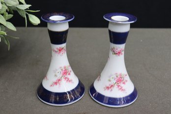 Pair Of Rose Painted Porcelain Pawn Candlestick Holders