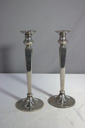 A Pair Of Art Deco Style Metal Alloy Candlesticks