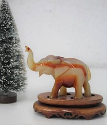 Carved Banded Onyx Lucky Elephant Statuette On Wood Base