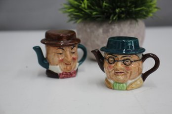 Pair Of Artone Pottery Double Sided Dickens Character Jug Mini Teapots