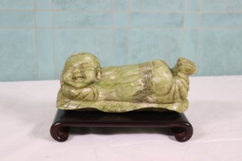 A Chinese Carved Serpentine Pillow In Form Of A Recumbent Boy