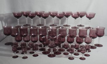 Large Collection Of Purple Wine Glasses With Clear Fancy Stems