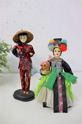 Two Vintage Traditional Asian Cloth Dolls Mounted On Wood Stands
