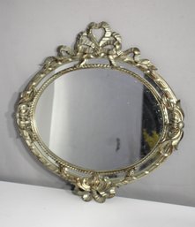 Ornate Oval Mirror With Gold-Toned Frame And Bow Detailing