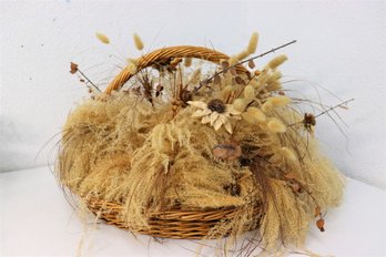 Artificial Dried Grasses And Botanical Bouquet In Wicker Handled Basket