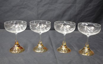 Set Of Four Elegant Champagne Glasses With Amber-Colored Base