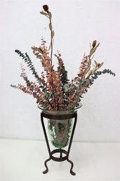 Faux Eucalyptus And Branches In Light Green Vase In Wrought Iron Tripod Stand