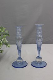 A Pair Of Ultramarine And Embossed Flower Baluster Candlesticks