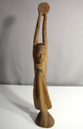 Unique Vintage Wood Carving Of A Figure Holding A Disc - Artistic Elegance