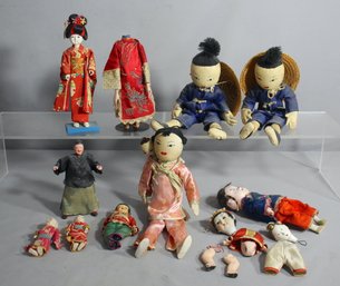 Collection Of Traditional Asian Dolls And Attire