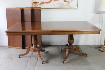 Expandable Mahogany Dining Table With Brass Capped Feet And Three Leaves