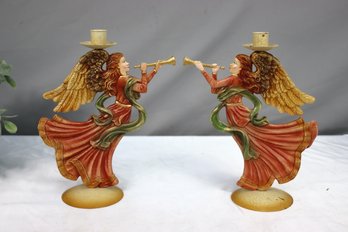 A Pair Of Ornate Painted Facing Musical Angels Candle Holders