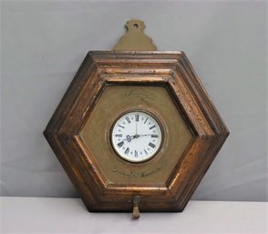 Hexagonal Wooden Clock With Circular White Dial And Roman Numerals