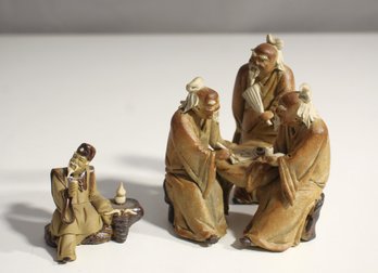 Set Of Oriental Mudman Scholar Figurines In Conversation