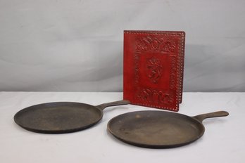 2 Vintage Lodge Cast Iron Flat Grill Pans - One Is Oval, One Is Round And A Tooled Red Leather Folio Folder