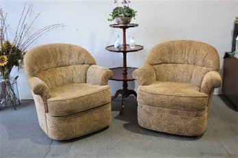 A Pair Of Plush Swivel Barrel Lounge Chairs