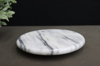 Round Marble Cheese Board Floating On Round Marble Base