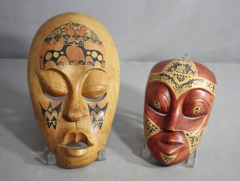Pair Of Hand-Carved African Tribal Masks With Intricate Patterns'