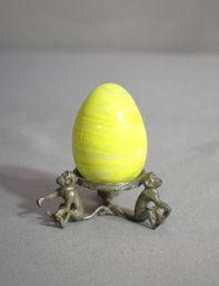 'Whimsical Metal  Monkey Egg Holder With Striped Yellow Art Glass Egg