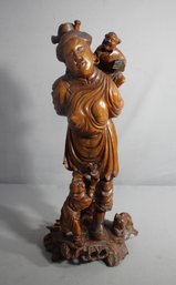Serenity In Sculpture: Exquisite Carved Wooden Figurine Of Happiness