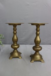 A Pair Of Brass Turned Spindle Pillar Candlesticks