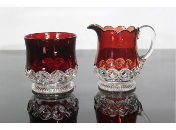 2 PIECE RUBY RED AND CLEAR GLASS SUGAR AND CREAMER SET