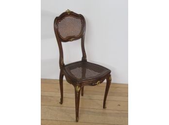 Single Mahogany Side Chair With Cane  And Bronze Decoration.