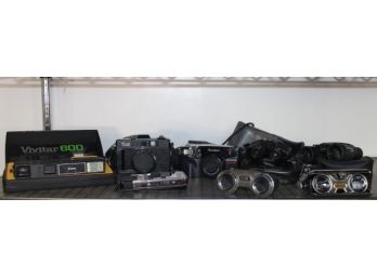 Shelf Lot Of Cameras & Binoculars
