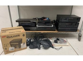 Shelf Lot Of DVD & CD Players And Stereo