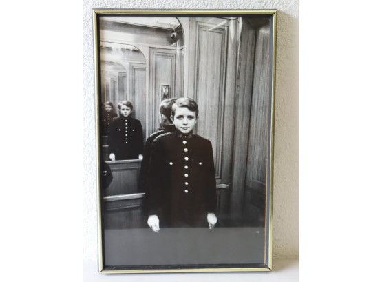 Young Elevator Operator In Mirror In Elevator - Matted And Framed