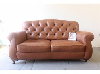 Natuzzi Cognac Loveseat Sofa With Rolled Arms Amd Tufted Back