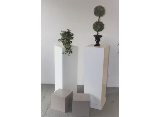 Two Tall Square Display Pillars And Two Low Display Cubes