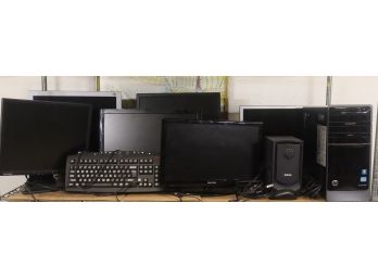 Shelf Lot Mucho PC Monitors, HP Pavillon Tower, Keyboard, And A Mouse