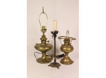 Three Electric Lamps:  Two Brass Oil Lamps And One Painted Cast Iron Candelabra