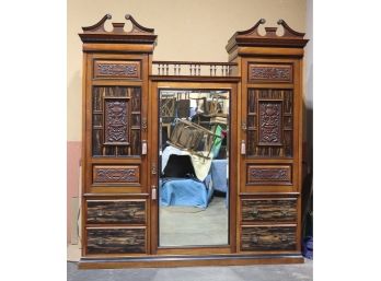 Massive Baronial Mirror In The Middle Double Armoire - Bas Relief Panels And Blond And Ebonized Finishes