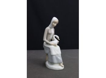 Casades Porcelanas Figurine Of A Seated Lass With Goose On Lap (Blue Logo Stamp On Bottom)