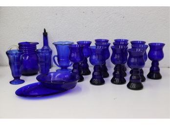 Mixed Blue Glass Lot: Plump Pedestal Goblets, Ribbed Ball Pitcher, And Other Cool Ones