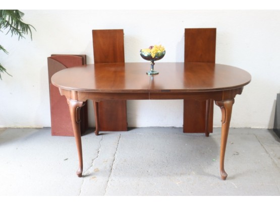 Two Leaf Extendable Mahogany Oval Dining Table