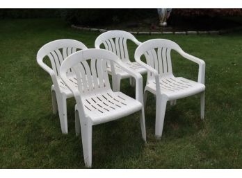 Four White Platic Outdoor Arm Chairs