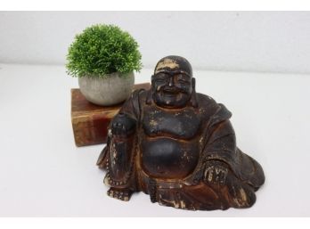 Laughing Buddha Dark Patina Figurine. Composition