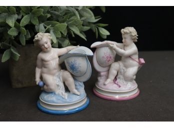 Pair Of Lustrous Porcelain Pink And Blue Putti Figurines