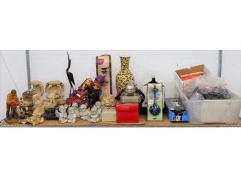 Shelf Lot Of Figurines And Decorative Objects Bolstered By A Couple Of Boxes Of Office Supplies