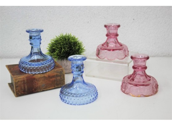 Two Dusty Rose Glass Candle Holders And Two Azure Blue Glass Hobnail Candle Holders